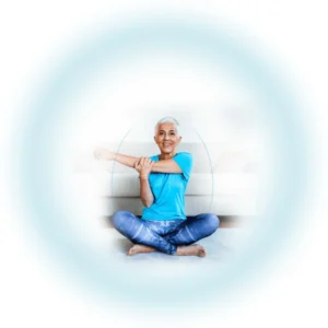 Woman stretching her arm while sitting cross-legged, symbolizing joint care and flexibility