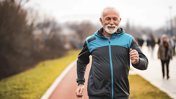 Older man running - smiling